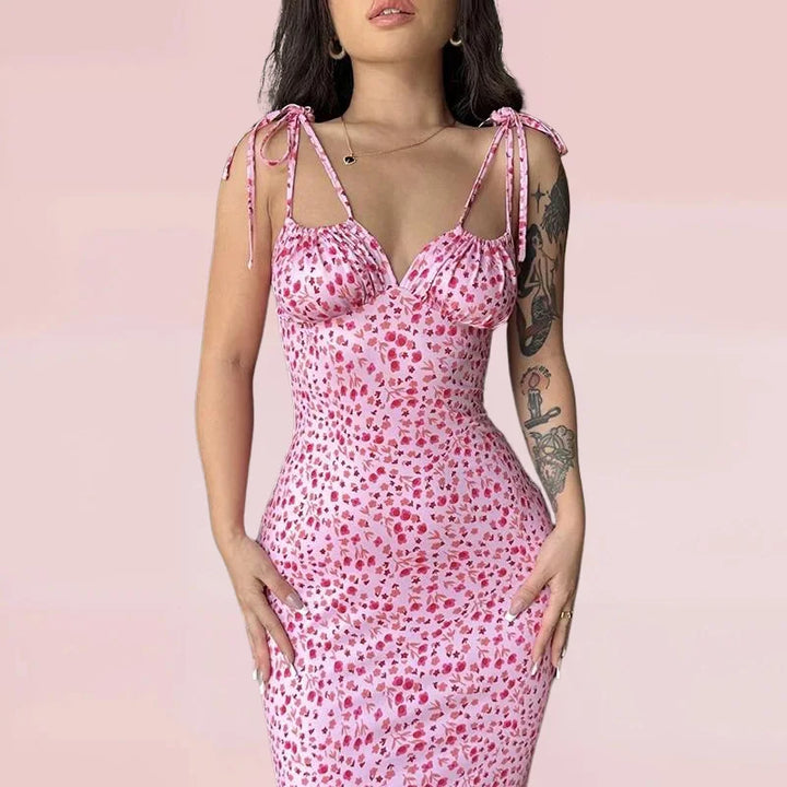 Sleeveless floral maxi dress in soft cotton blend, featuring a vibrant floral pattern on a black background. Perfect for…