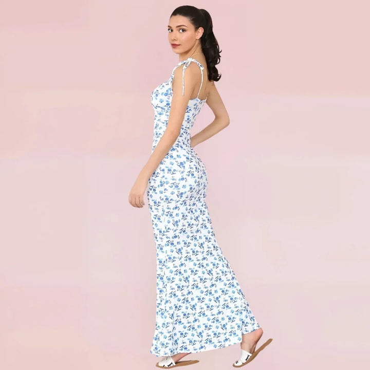 Sleeveless blue floral maxi dress with a lightweight, flowy fabric perfect for summer days. Floral pattern adds a touch of…