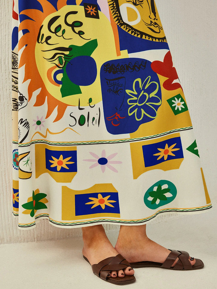 Colorful midi dress with playful prints in soft and lightweight fabric, featuring cami straps and a flattering A-line…