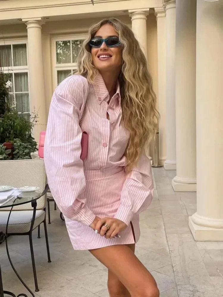 Pink striped dress with slit detail, perfect for casual outings. Made of soft, breathable fabric with a chic and stylish…