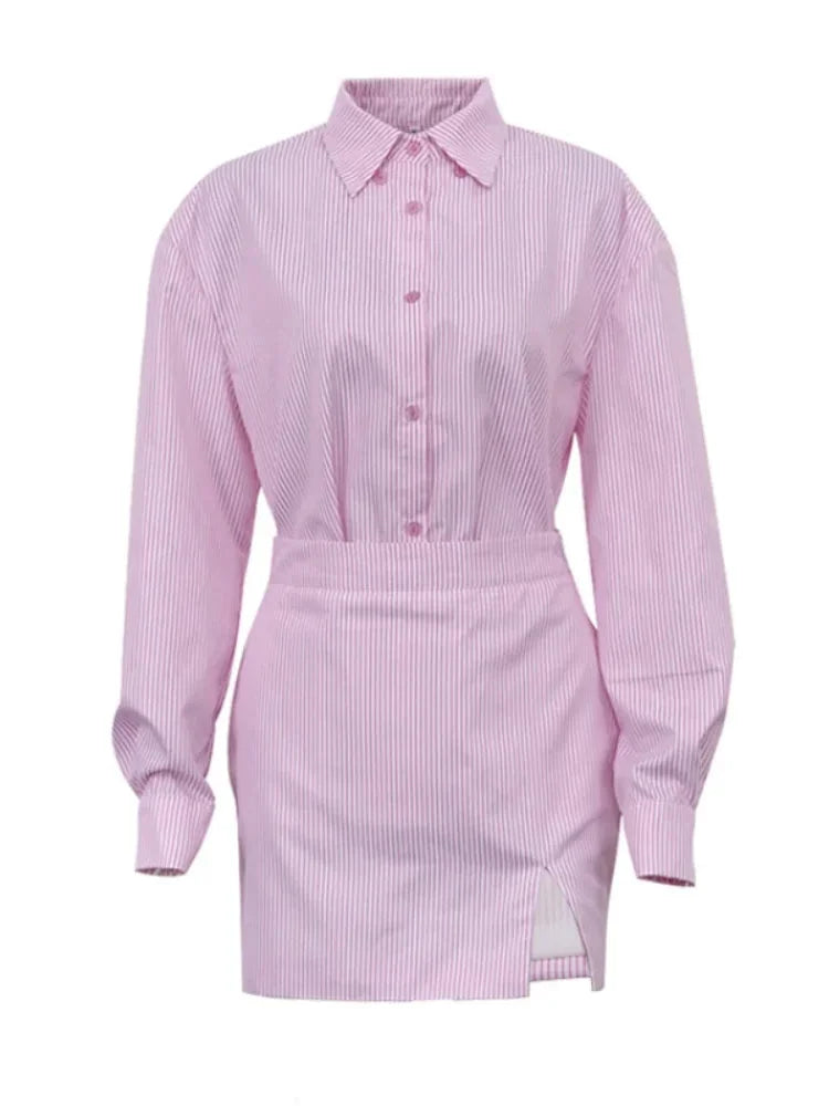 Pink striped dress with slit detail, perfect for a casual chic look made from soft and lightweight fabric.