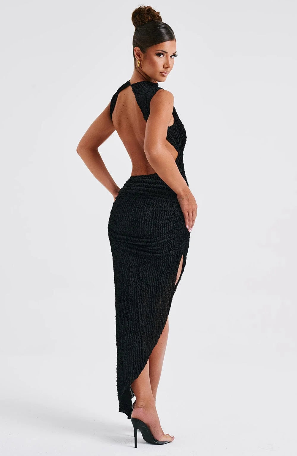 "Sandy sleeveless maxi dress in textured fabric with unique side cut-out detail"