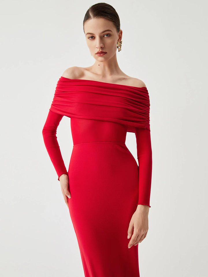 "Black off-shoulder dress with mesh sleeves, fitted silhouette. Stylish and elegant design for special occasions."