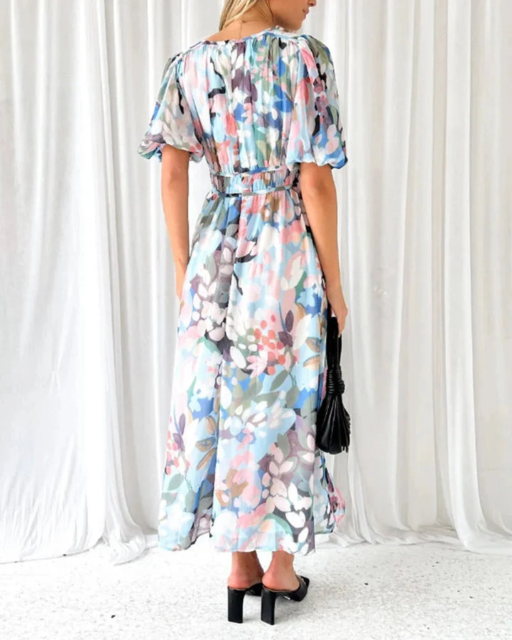 "Scottlynn floral maxi dress featuring long sleeves, made of lightweight fabric with a vibrant floral pattern."