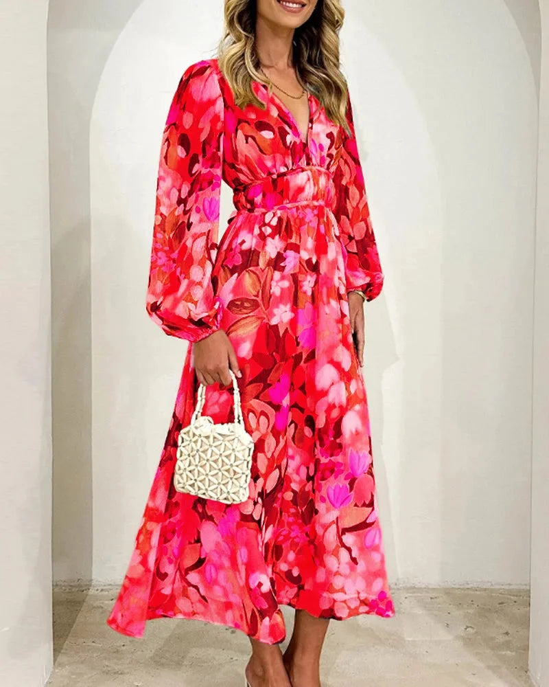 "Floral maxi dress featuring long sleeves, flowing silhouette, crafted from soft fabric with intricate floral pattern."