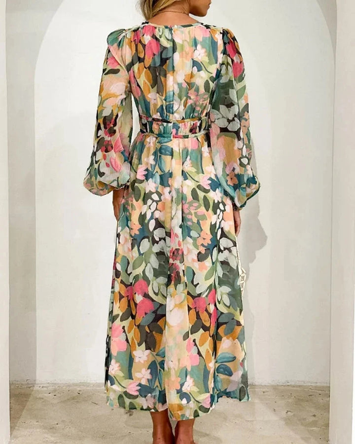 "Floral maxi dress in deep blue with long sleeves, featuring a striking design perfect for any casual or dressy occasion."