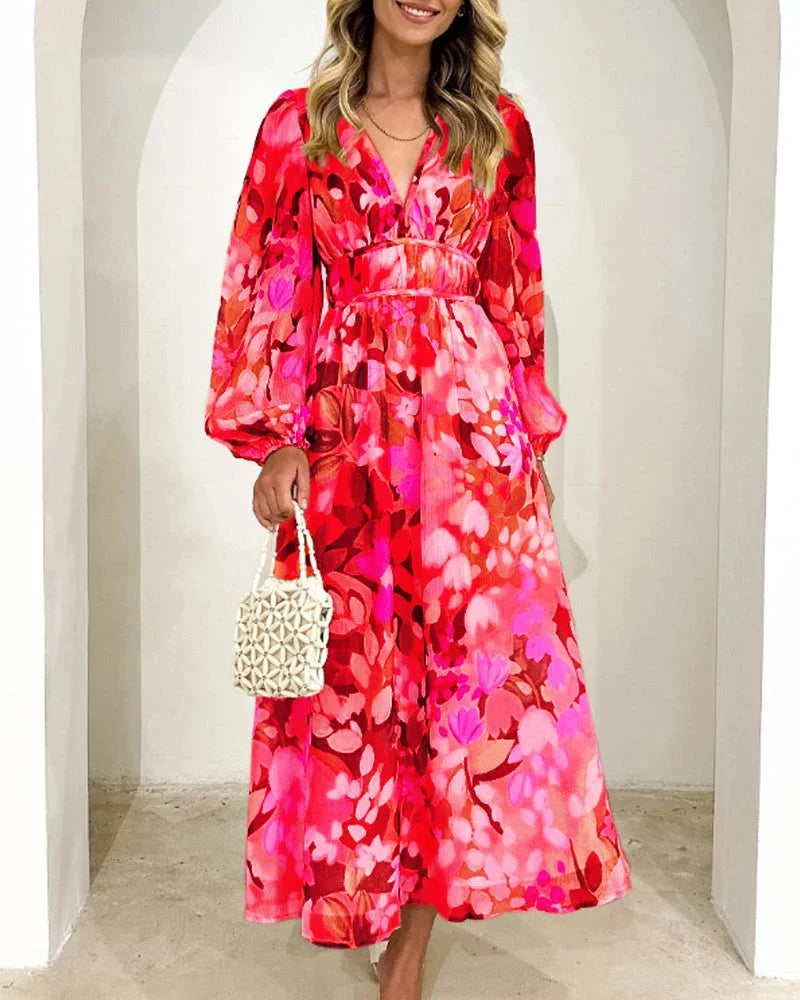 Floral maxi dress with long sleeves featuring a soft chiffon fabric and a vibrant floral print perfect for elegant…