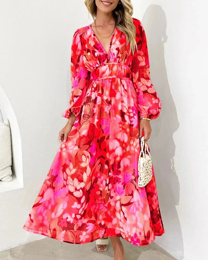 Red floral maxi dress with long sleeves, perfect for a casual yet stylish look. Made of comfortable and breathable fabric.