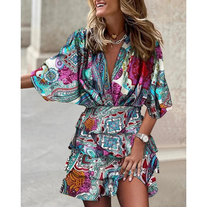 "Blue tiered abstract mini dress with a vibrant design, perfect for making a statement. Made from premium quality materials."
