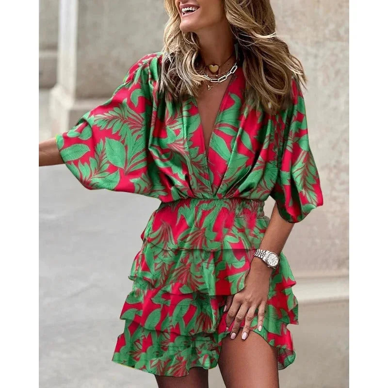 Green abstract mini dress with tiered design, vibrant colors, and flowy silhouette. Made from lightweight and breathable…