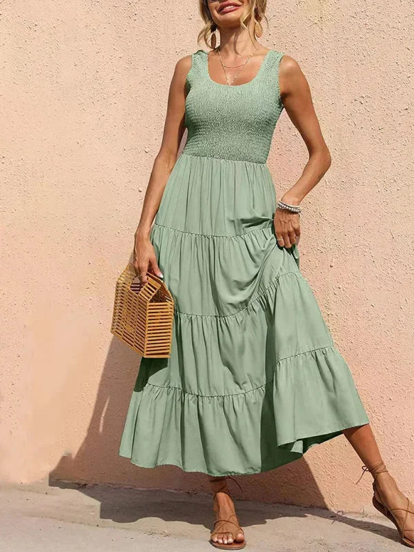 "Sleeveless maxi dress in Green with smocked bodice detail, made of soft and breathable fabric."