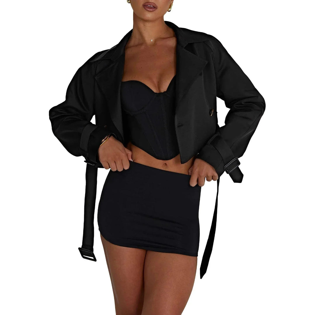 Black cropped trench coat in modern design by Sevynn. Made from durable and stylish material, perfect for a fashionable…