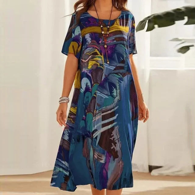 "Blue knee-length modesty dress in a loose fit style, made from soft and breathable fabric. Features long sleeves and a…