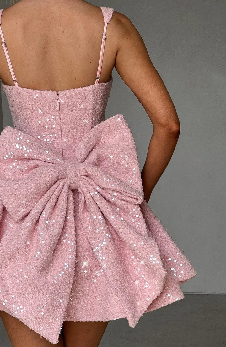 Shania fit and flare mini dress in dazzling sequined fabric with a V-neckline and cap sleeves for a glamorous look.