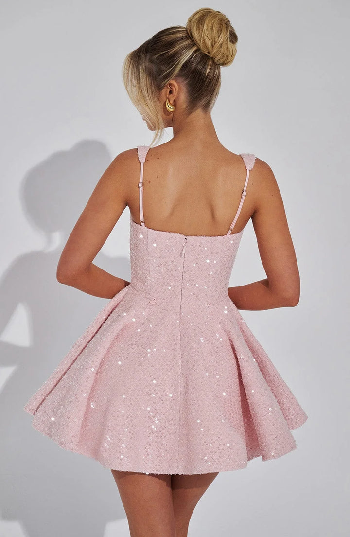 "Shania Sparkling fit and flare mini dress in silver sequin material with plunging neckline and open back, perfect for…
