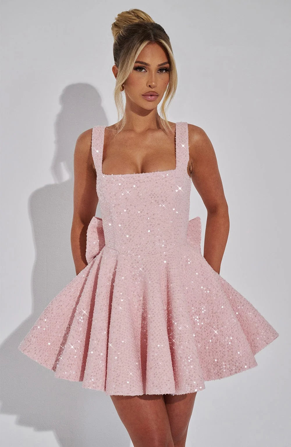Shania mini dress in sparkling fabric with fit and flare silhouette for a trendy chic look at your next event.