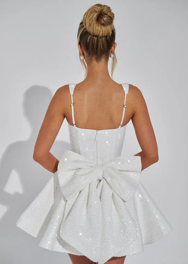 "Shania mini dress in sparkling fit-and-flare design, made of shimmering fabric with intricate details, perfect for special…