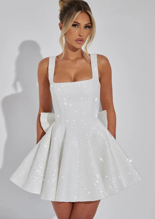 White fit and flare mini dress 'Shania' featuring sparkling embellishments. Ideal for special occasions and crafted from…