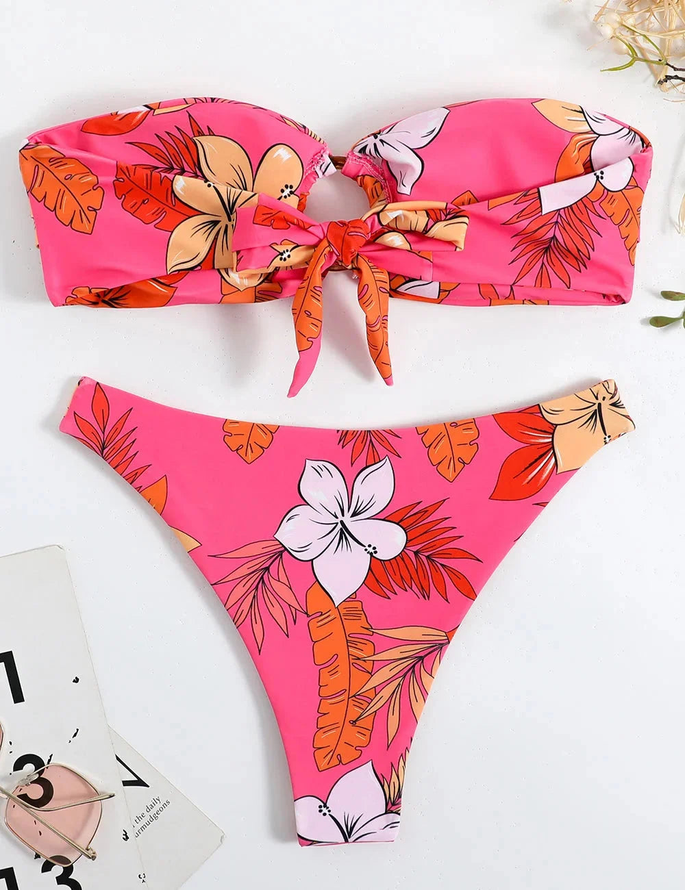 Pink strapless bikini with floral print, ring detail. Made from soft shea fabric. Ideal for sunny days by the water.