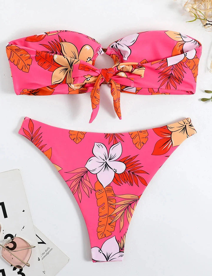 Pink strapless bikini with floral print, ring detail. Made from soft shea fabric. Ideal for sunny days by the water.