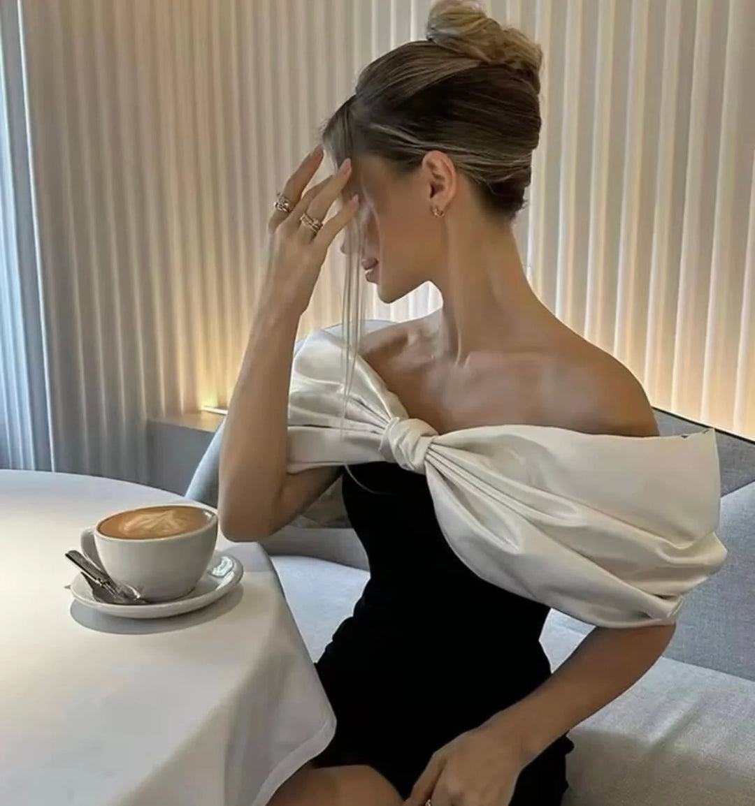 White off-shoulder dress with bow detail in soft flowing fabric - the Shelby dress is effortlessly elegant and perfect for…