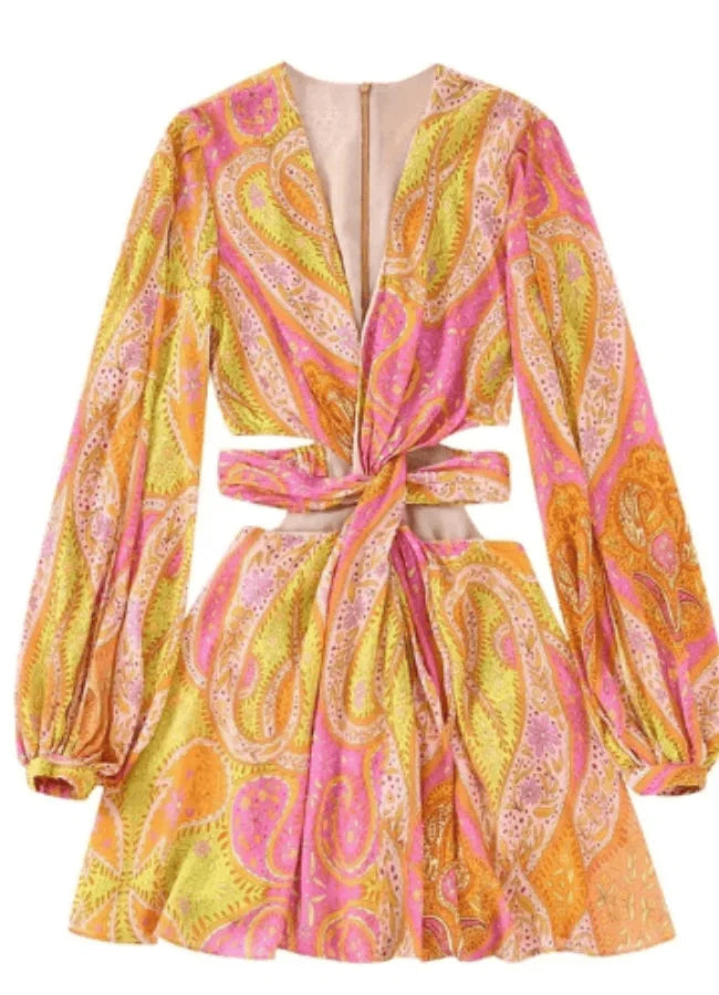 Pink and yellow patterned mini dress with V-neck, made of soft cotton blend. Ideal for a casual yet stylish look.