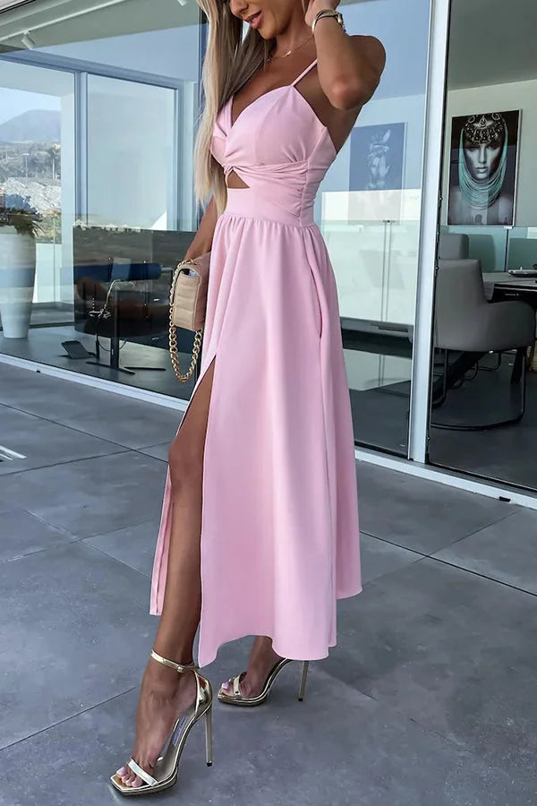 Black midi dress featuring cut-out detail at the waist and convenient side pockets. Classic and stylish design for everyday…