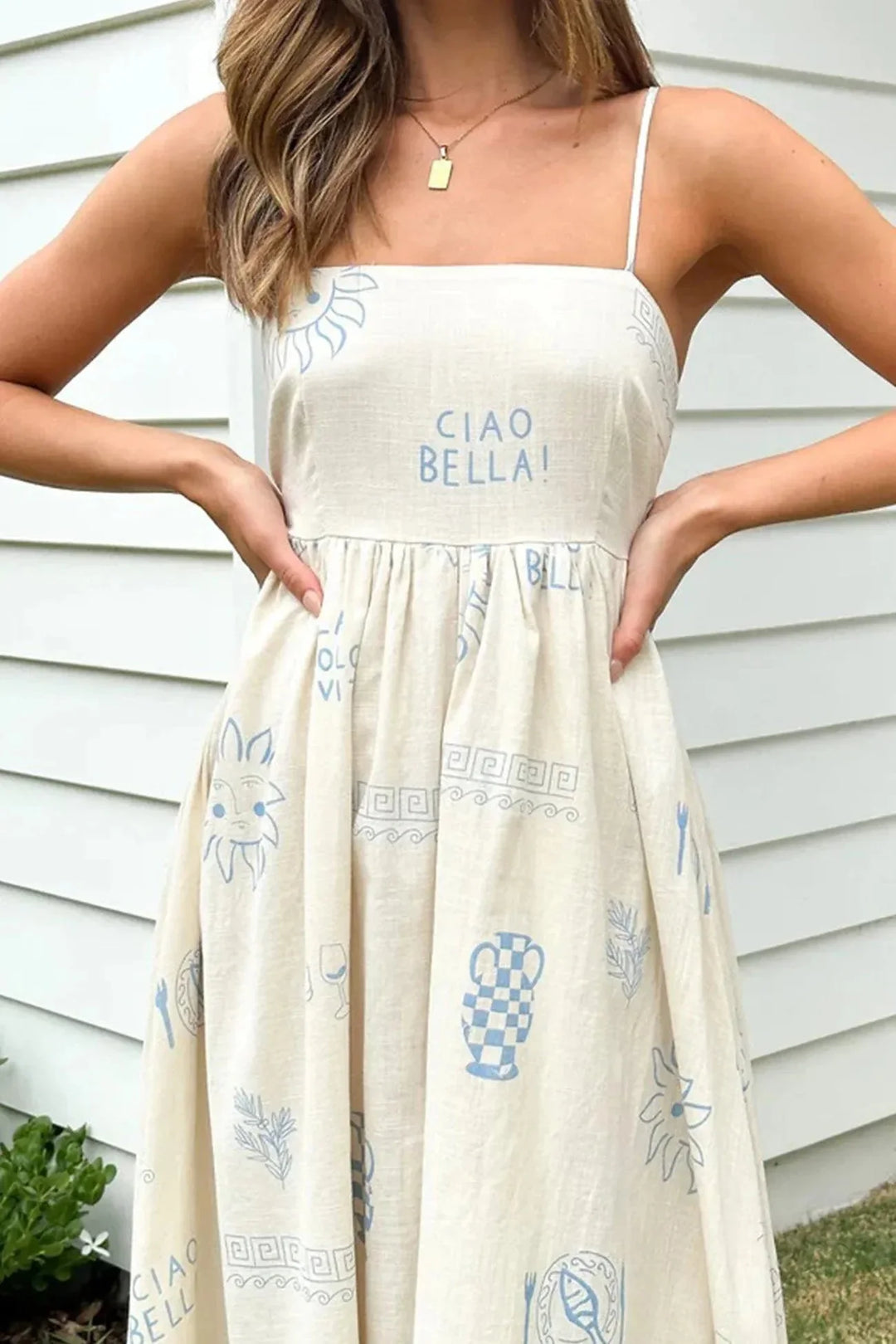 "White printed spaghetti strap maxi dress in Blue White, featuring a stylish pattern design and lightweight, breathable…