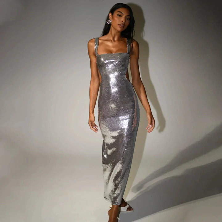 Glamorous floor-length dress featuring intricate sequin detailing in a classic silhouette, perfect for formal events and…
