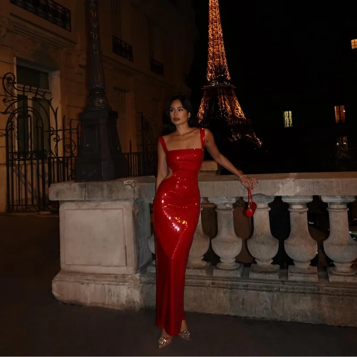 Red floor-length dress with intricate sequin detailing, perfect for formal events. Classic design with a hint of glamour.