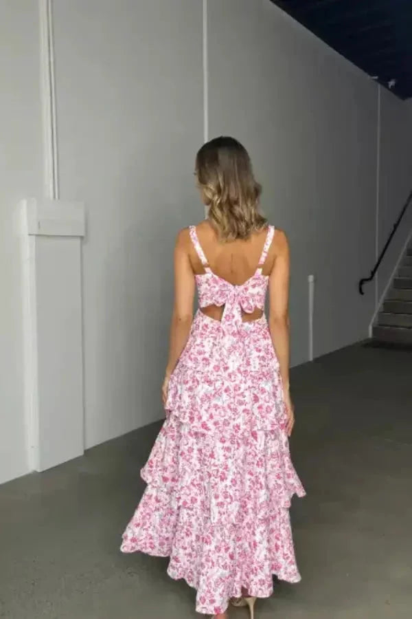 Silver strapless dress with three-tier floral design, perfect for special occasions.