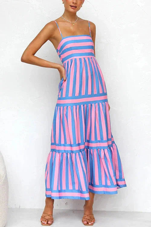 "Silvia tiered maxi dress in light beige, with strappy top, flowy silhouette, and intricate lace detailing."