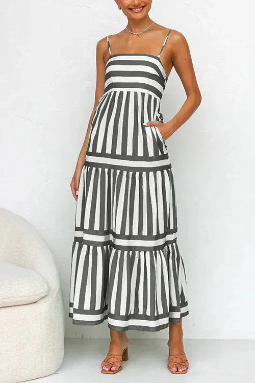 Silvia tiered maxi dress in navy with strappy top, made of eco-friendly cotton blend, flowing and elegant for summer style.