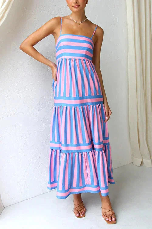 Blue tiered maxi dress with strappy top. Flowy and lightweight fabric, perfect for summer days or special occasions.