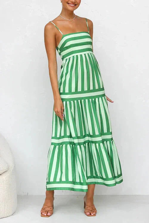 "Silvia tiered maxi dress in Green, featuring a strappy top design. Made from lightweight flowy fabric for a breezy summer…