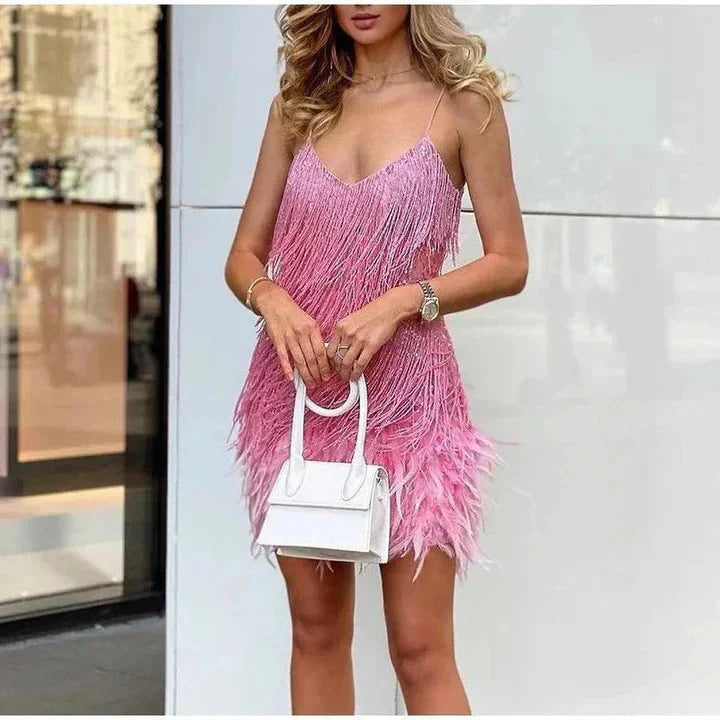 Pink Skyla cocktail dress with sparkling fringe, modern cut, perfect for special occasions.