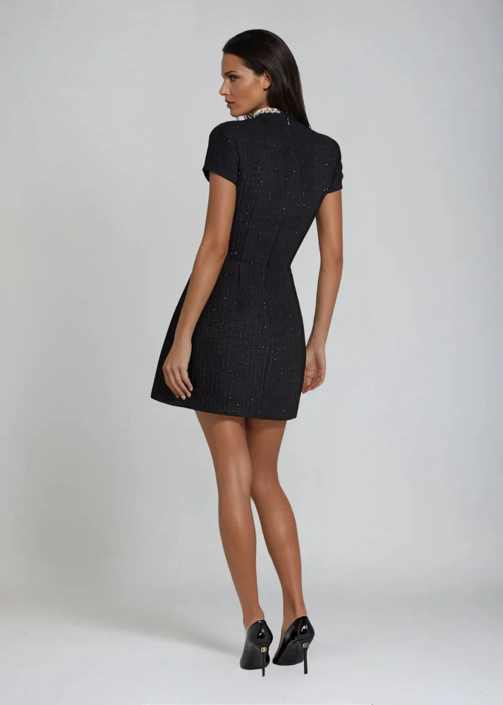 Skylynn Mini Dress: Sleeveless mock neck design with delicate bead details, perfect for any occasion.