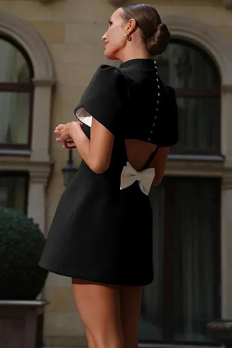Navy blue mini dress with elegant ruffle sleeves, perfect for formal events or date nights.