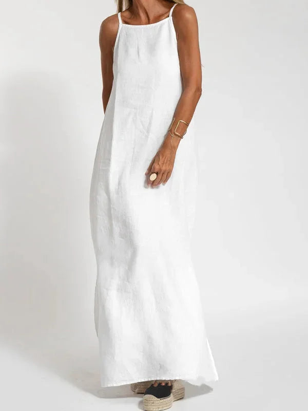 "Susan sleeveless maxi dress in white - featuring a flowing silhouette and airy fabric perfect for summer days."