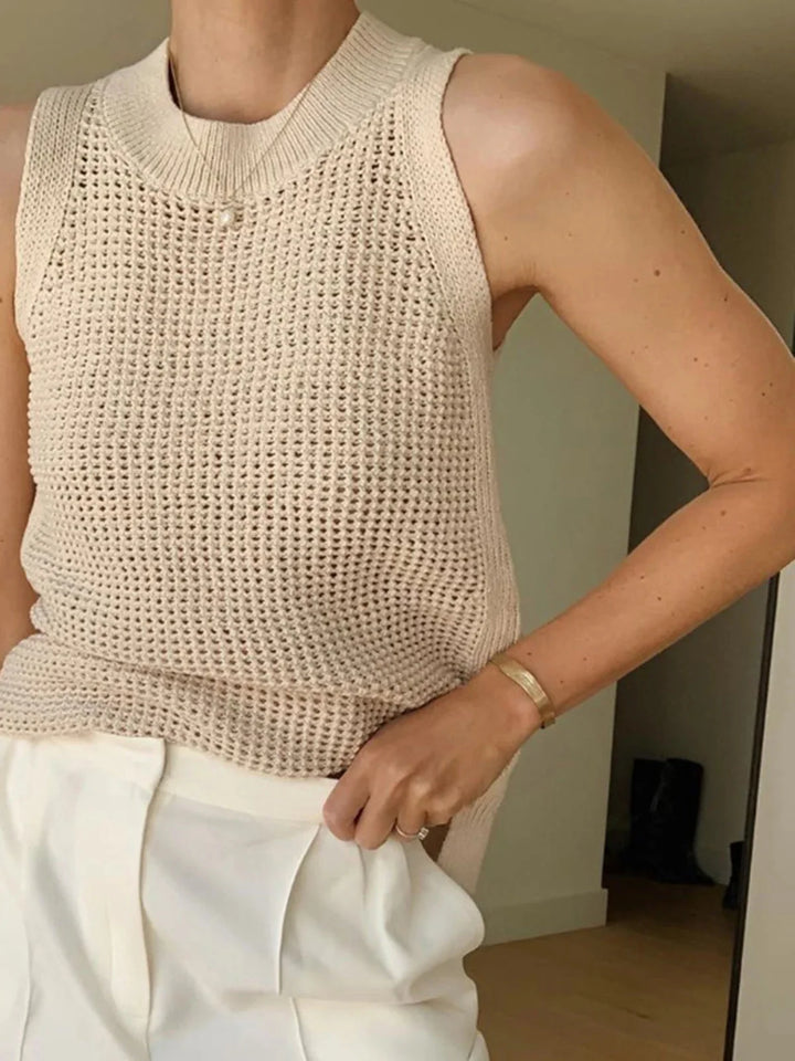 "Black sleeveless knit top with breathable fabric perfect for warm weather, designed for comfort and style"