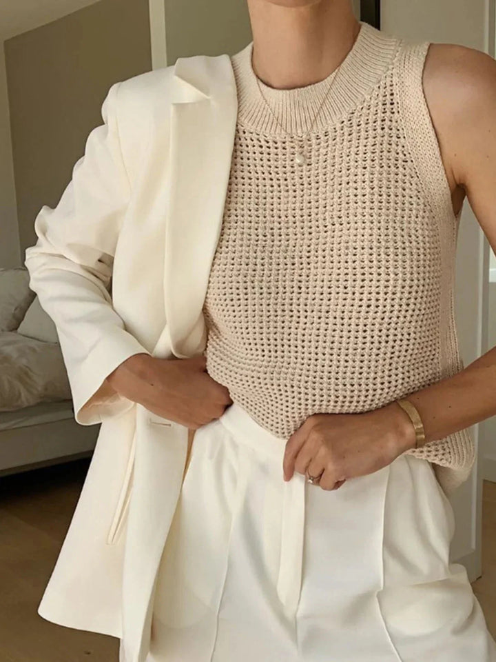 Sleeveless knit top featuring breathable fabric with a chic design.