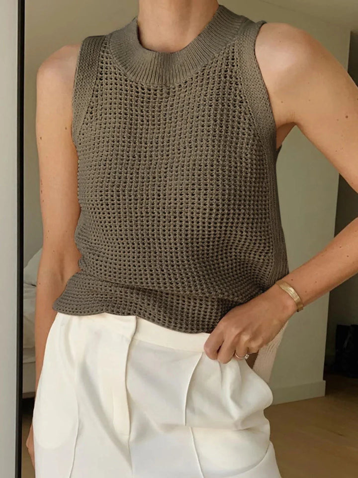 Dark brown sleeveless knit top in breathable fabric with a textured design.