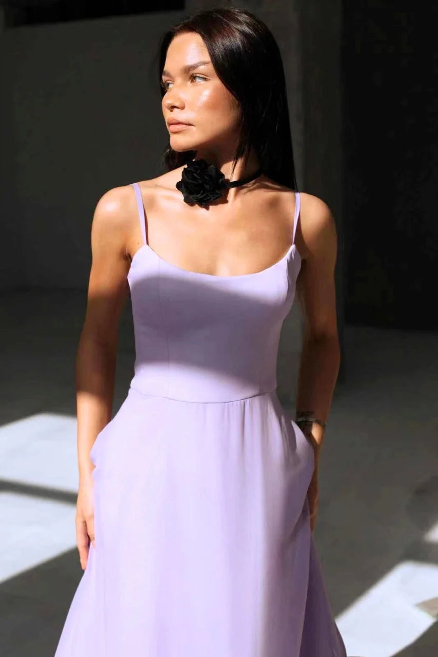 Sleeveless dress in light blue with a ruffled hemline, made of soft cotton blend fabric for a stylish and comfortable look.