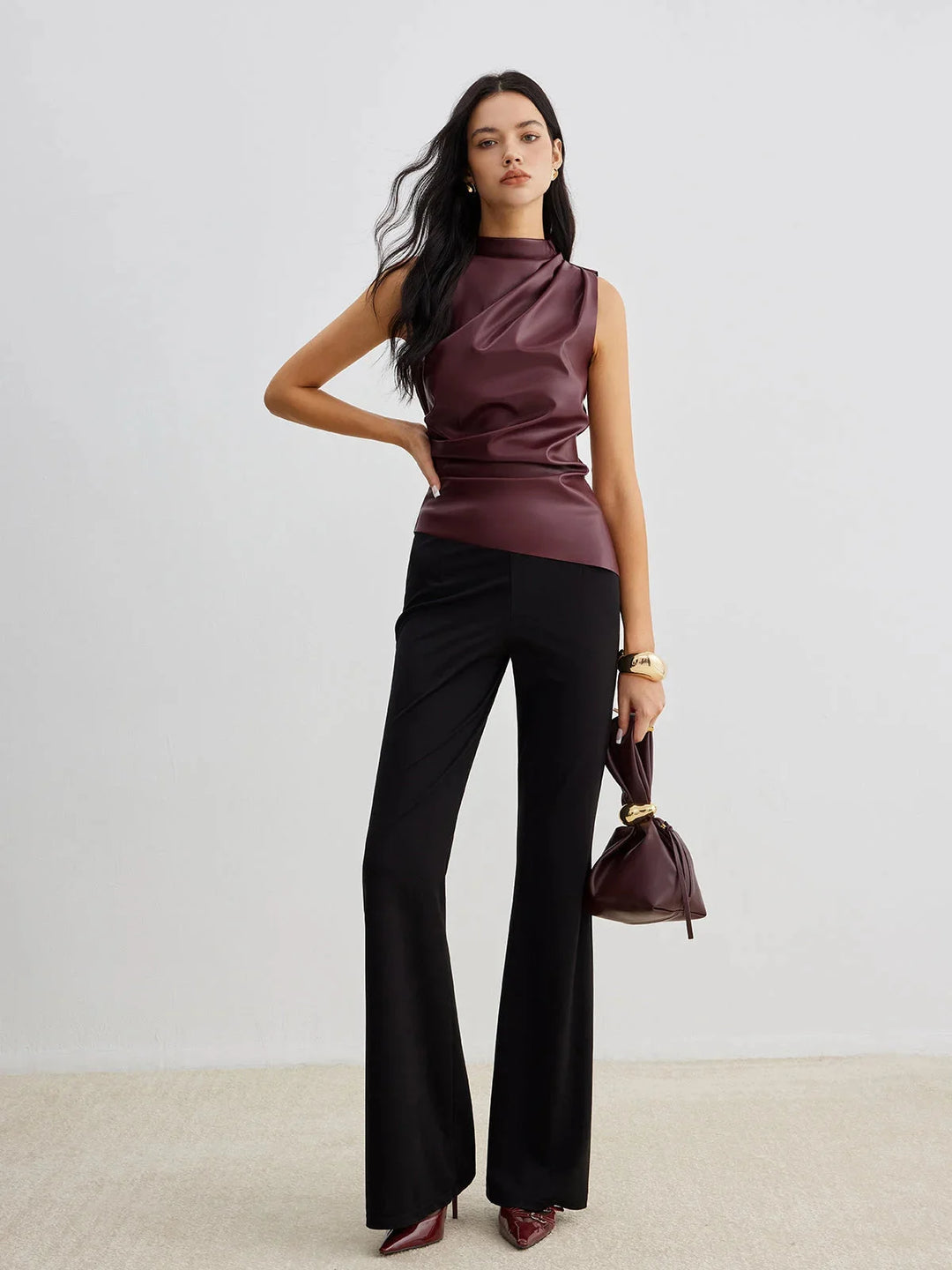 Sleeveless satin top with gathered neckline in elegant design for versatile styling.