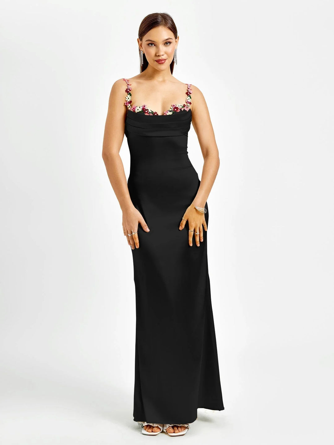 "Sleeveless maxi dress in blue with intricate embellishments, perfect for special occasions or evenings out."
