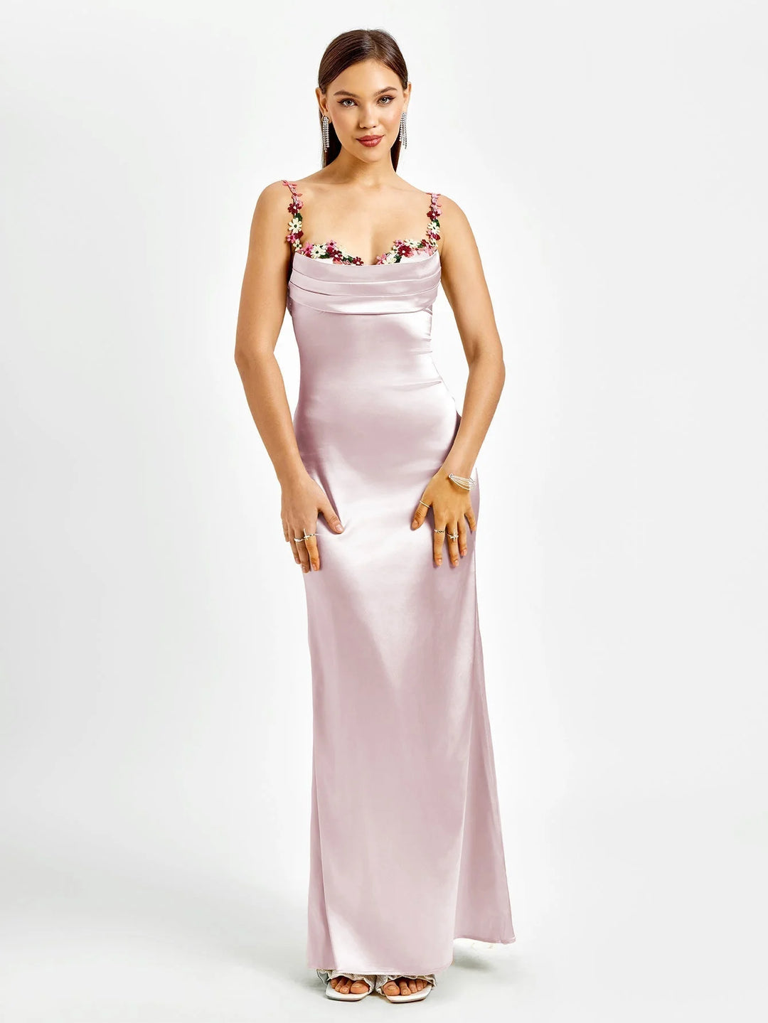 "Sleeveless fitted maxi dress in black with intricate embellishments, perfect for elegant evenings."