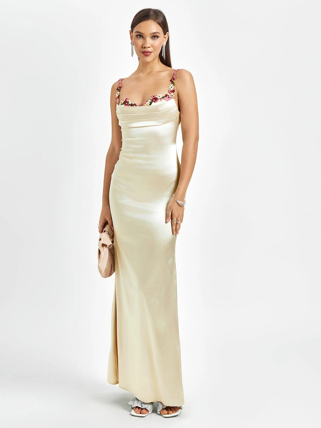 Champagne sleeveless maxi dress, adorned with embellishments, in a fitted silhouette – perfect for special occasions.