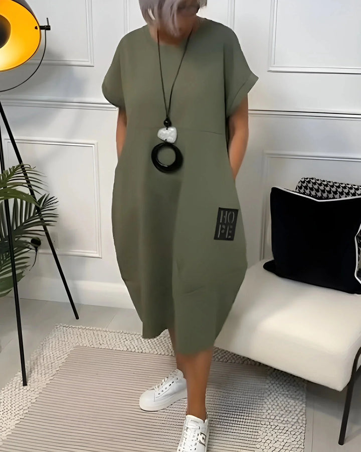 Green dress made from soft, breathable fabric with a comfortable fit. Stylish design perfect for everyday wear.