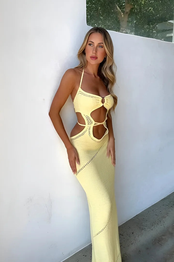Yellow halterneck midi dress with cut-outs in stretchy knit fabric, perfect for a sunny day out or a casual night event.