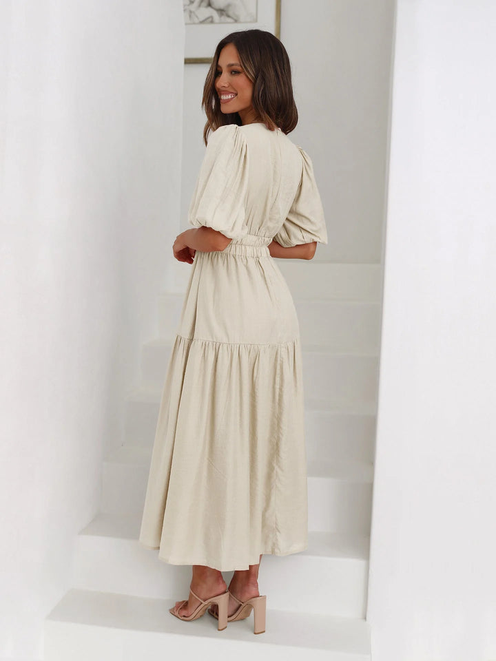 "Black V-neck midi dress with elastic waist, made from soft, stretchy fabric - ideal for casual chic style and all-day…